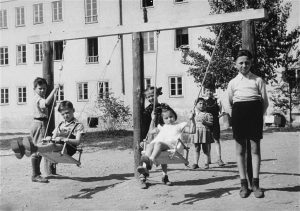 Children at play in the Bindermichl displaced persons (DP) camp in Linz, Austria, 1947. Photo credit: USHMM #11850