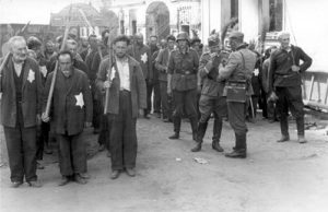 Jewish forced laborers from the Mogilev ghetto on the way to work in Belarus, 1941. Photo credit: Yad Vashem #3955/360