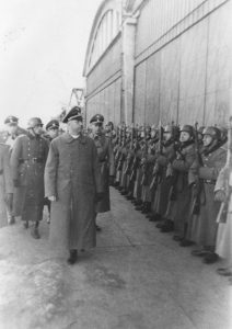SS Chief Heinrich Himmler reviews a unit of SS police in Kraków, Poland, March 13, 1942. Photo credit: USHMM #60389