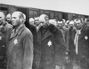 Jewish men from Subcarpathian Rus await selection on the ramp at the Auschwitz-Birkenau extermination camp in Nazi-occupied Poland, May 1944. Photo credit: USHMM #77297