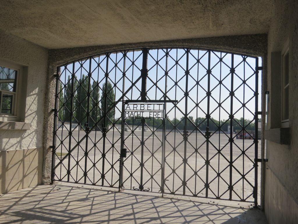 Gate bearing the phrase "Arbeit Macht Frei" ("Work Shall Set You Free") at the entrance to the Dachau concentration camp memorial in Germany, 2015.