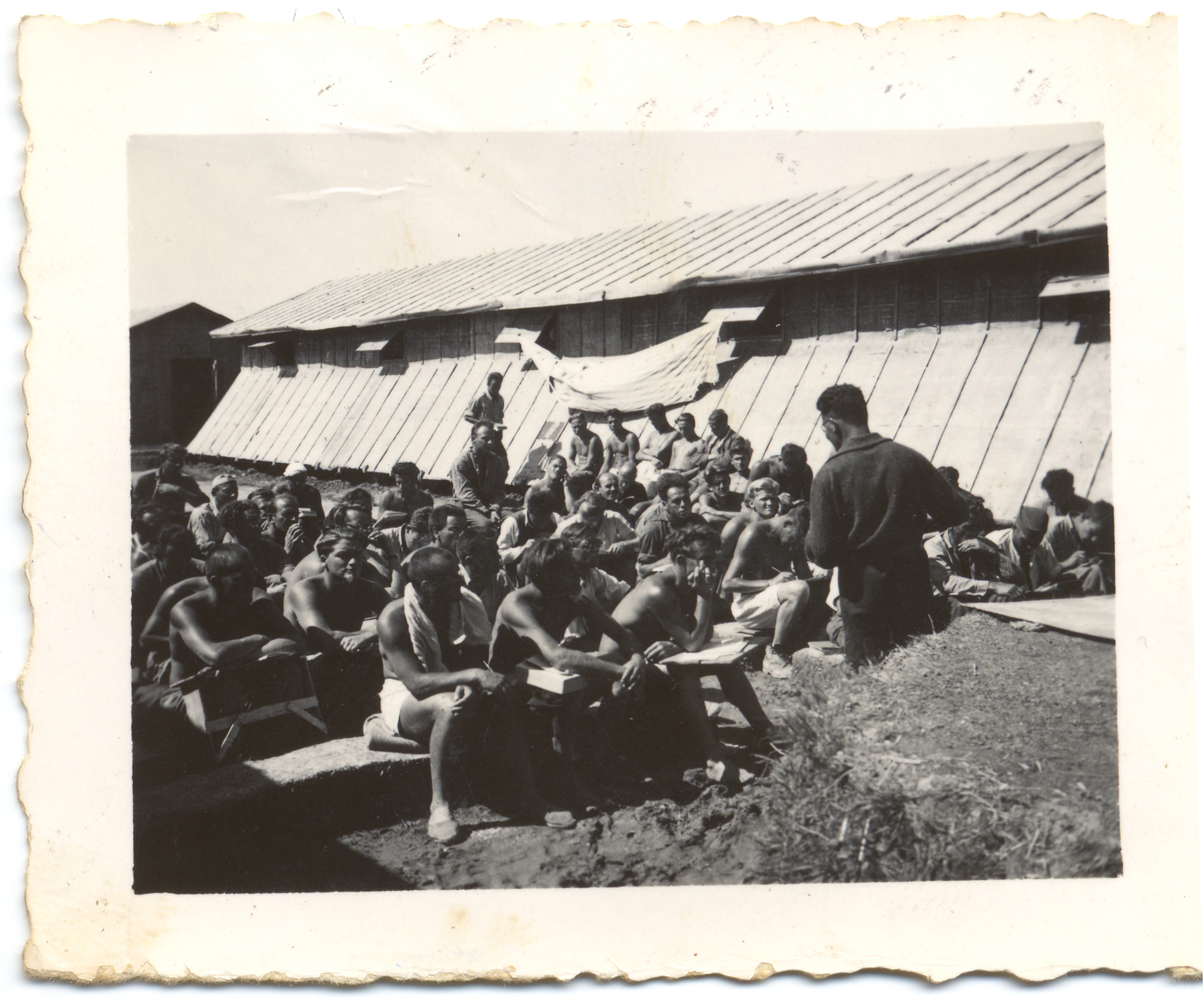 Prisoners listen to a speaker in the Gurs Internment Camp