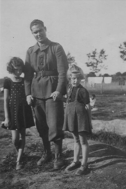 Renee Kann Silver and her sister pictured with a refugee soldier from the Spanish Civil War