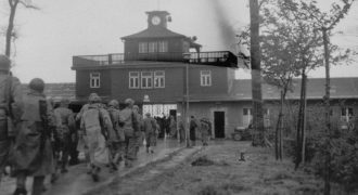 Image of American soldiers march into Buchenwald upon liberation of the camp. Photo credit: United States Holocaust Memorial Museum, courtesy of Virginia Longest
