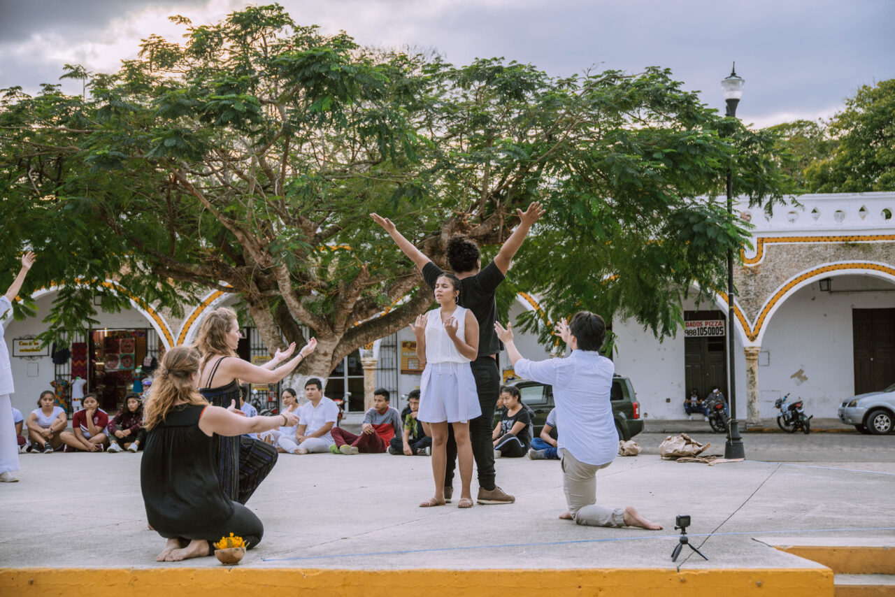 Image of a performance using Social Presencing Theater, town square, Izamal, Yucatan.